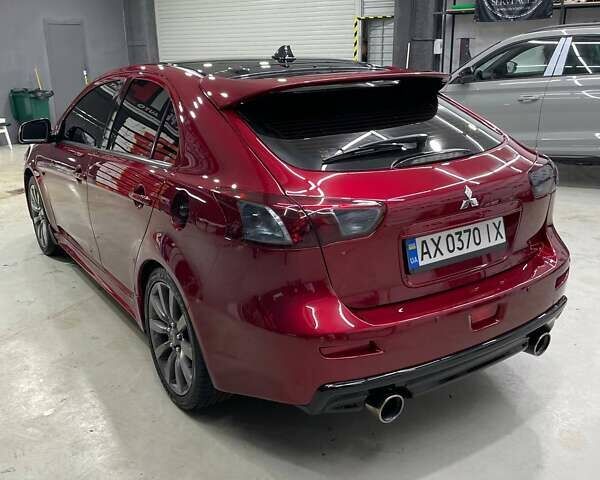 Красный Мицубиси Лансер, объемом двигателя 2 л и пробегом 128 тыс. км за 14700 $, фото 2 на Automoto.ua