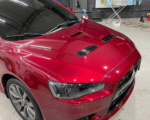 Красный Мицубиси Лансер, объемом двигателя 2 л и пробегом 128 тыс. км за 14700 $, фото 3 на Automoto.ua