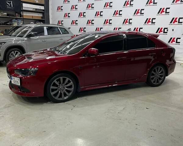 Красный Мицубиси Лансер, объемом двигателя 2 л и пробегом 128 тыс. км за 14700 $, фото 1 на Automoto.ua