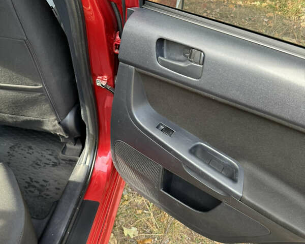 Красный Мицубиси Лансер, объемом двигателя 1.8 л и пробегом 162 тыс. км за 6900 $, фото 32 на Automoto.ua