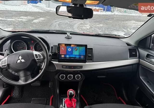 Красный Мицубиси Лансер, объемом двигателя 1.8 л и пробегом 282 тыс. км за 9300 $, фото 32 на Automoto.ua