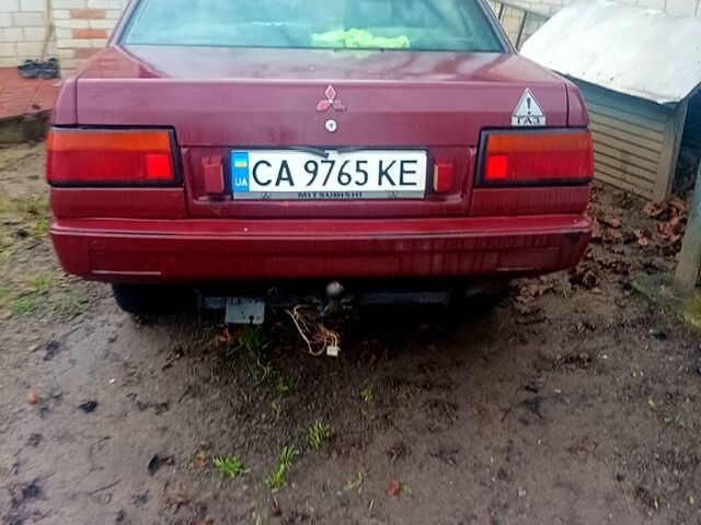 Красный Мицубиси Лансер, объемом двигателя 1.5 л и пробегом 310 тыс. км за 600 $, фото 4 на Automoto.ua