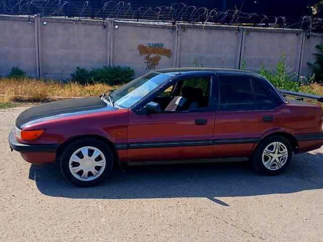 Червоний Міцубісі Lancer, об'ємом двигуна 1.3 л та пробігом 370 тис. км за 1100 $, фото 4 на Automoto.ua