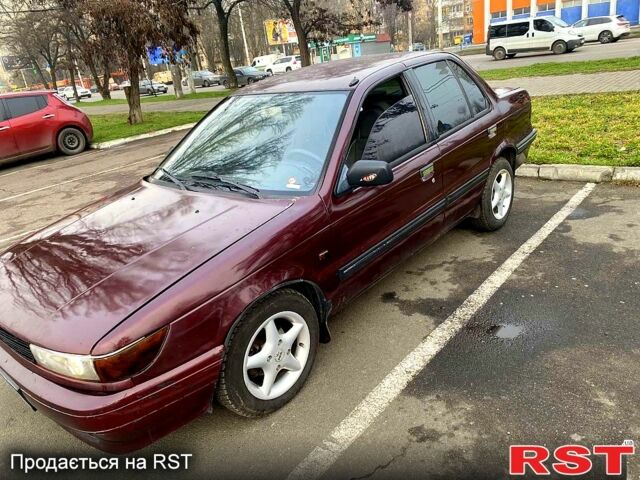 Красный Мицубиси Лансер, объемом двигателя 1.2 л и пробегом 420 тыс. км за 1900 $, фото 1 на Automoto.ua