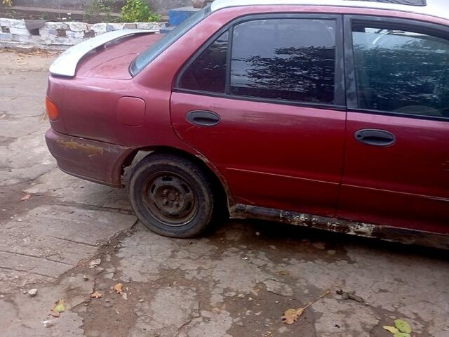 Червоний Міцубісі Lancer, об'ємом двигуна 1.6 л та пробігом 24 тис. км за 650 $, фото 1 на Automoto.ua