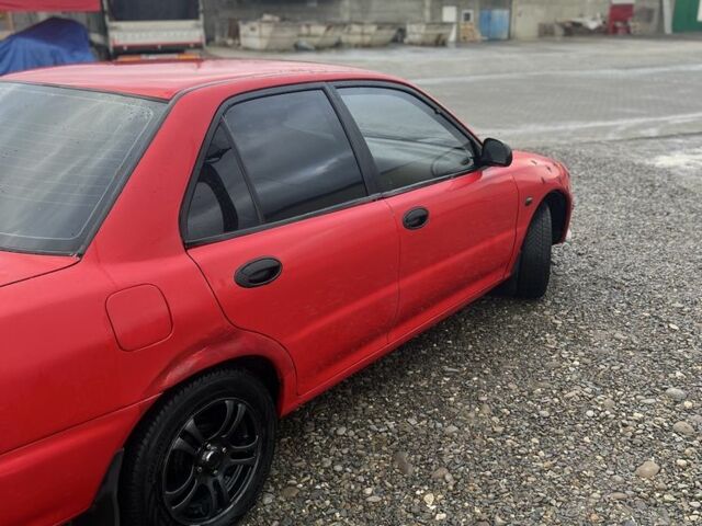 Червоний Міцубісі Lancer, об'ємом двигуна 1.3 л та пробігом 390 тис. км за 1500 $, фото 3 на Automoto.ua