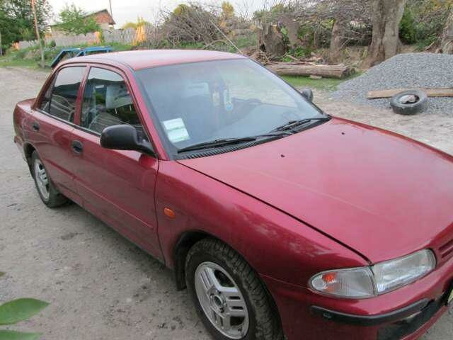 Червоний Міцубісі Lancer, об'ємом двигуна 2 л та пробігом 300 тис. км за 3000 $, фото 2 на Automoto.ua