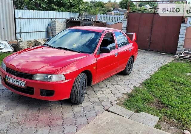 Червоний Міцубісі Lancer, об'ємом двигуна 1.3 л та пробігом 430 тис. км за 2300 $, фото 5 на Automoto.ua