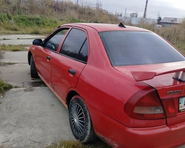 Червоний Міцубісі Lancer, об'ємом двигуна 1.3 л та пробігом 290 тис. км за 750 $, фото 1 на Automoto.ua