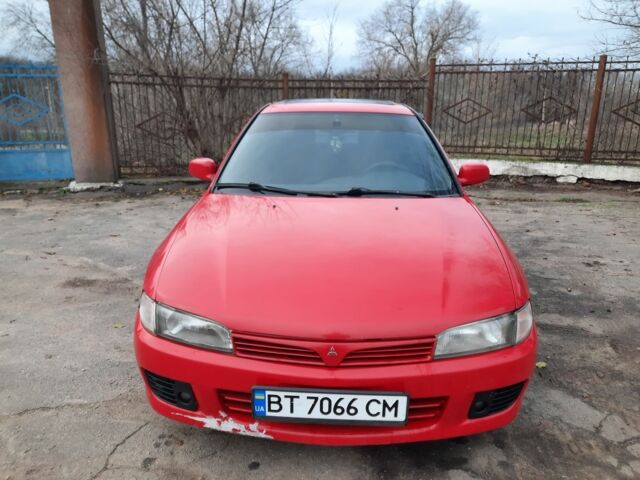 Красный Мицубиси Лансер, объемом двигателя 1.3 л и пробегом 409 тыс. км за 2000 $, фото 2 на Automoto.ua