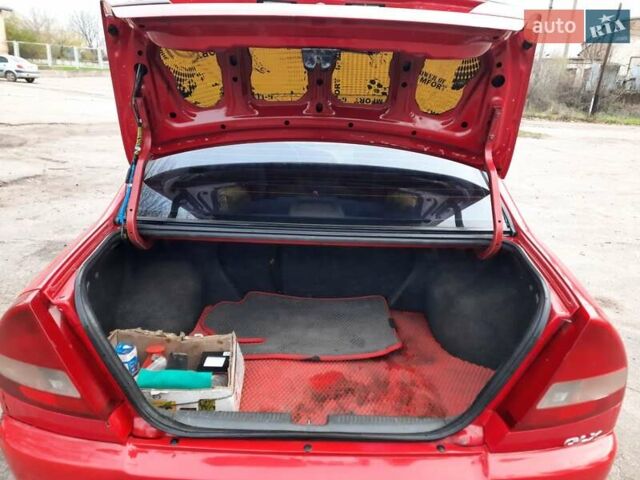 Красный Мицубиси Лансер, объемом двигателя 1.3 л и пробегом 409 тыс. км за 2000 $, фото 6 на Automoto.ua