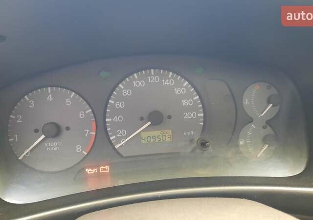 Красный Мицубиси Лансер, объемом двигателя 1.3 л и пробегом 409 тыс. км за 2000 $, фото 14 на Automoto.ua