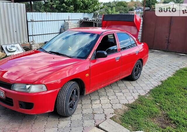 Червоний Міцубісі Lancer, об'ємом двигуна 1.3 л та пробігом 430 тис. км за 2300 $, фото 7 на Automoto.ua