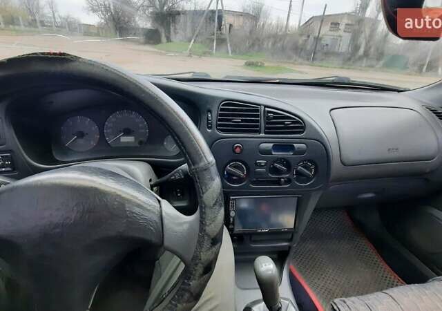 Красный Мицубиси Лансер, объемом двигателя 1.3 л и пробегом 409 тыс. км за 2000 $, фото 13 на Automoto.ua