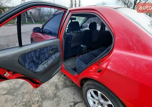 Красный Мицубиси Лансер, объемом двигателя 1.3 л и пробегом 409 тыс. км за 2000 $, фото 10 на Automoto.ua