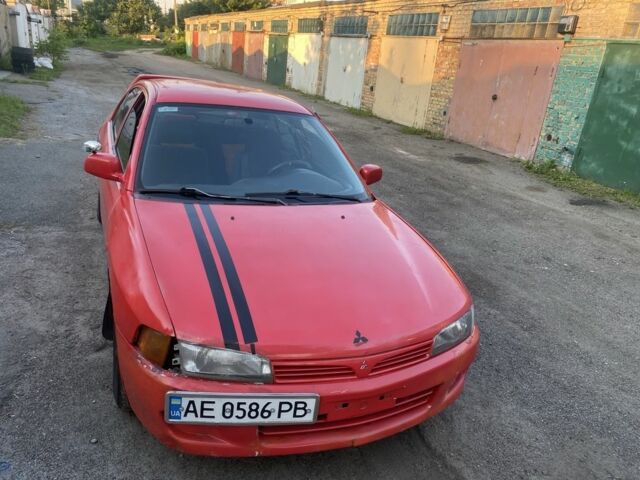 Красный Мицубиси Лансер, объемом двигателя 1.3 л и пробегом 330 тыс. км за 1200 $, фото 7 на Automoto.ua