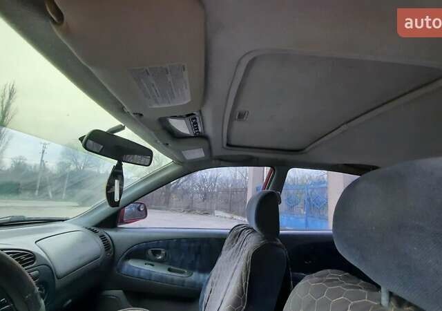 Красный Мицубиси Лансер, объемом двигателя 1.3 л и пробегом 409 тыс. км за 2000 $, фото 9 на Automoto.ua