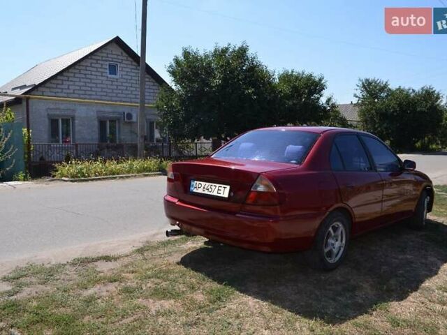 Красный Мицубиси Лансер, объемом двигателя 1.3 л и пробегом 396 тыс. км за 2800 $, фото 9 на Automoto.ua