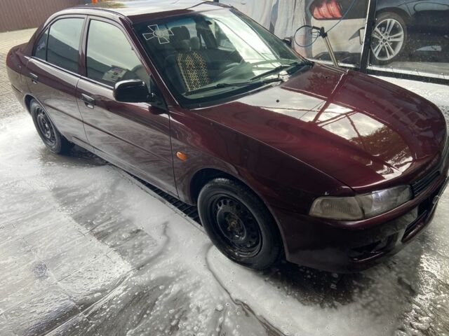 Червоний Міцубісі Lancer, об'ємом двигуна 1.3 л та пробігом 275 тис. км за 1500 $, фото 5 на Automoto.ua