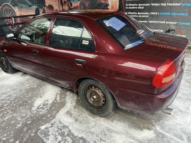 Червоний Міцубісі Lancer, об'ємом двигуна 1.3 л та пробігом 275 тис. км за 1500 $, фото 6 на Automoto.ua