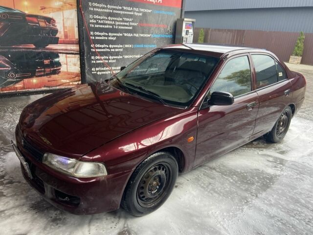 Червоний Міцубісі Lancer, об'ємом двигуна 1.3 л та пробігом 275 тис. км за 1500 $, фото 1 на Automoto.ua