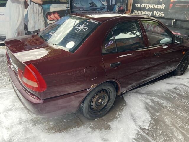 Червоний Міцубісі Lancer, об'ємом двигуна 1.3 л та пробігом 275 тис. км за 1500 $, фото 4 на Automoto.ua