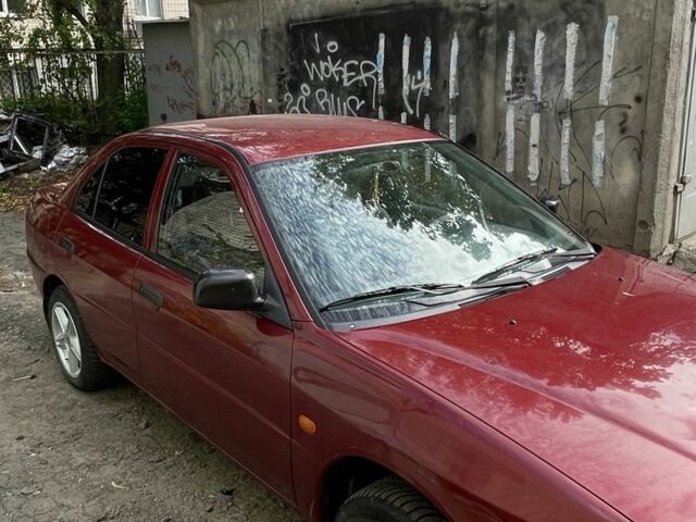 Червоний Міцубісі Lancer, об'ємом двигуна 1.3 л та пробігом 250 тис. км за 2000 $, фото 1 на Automoto.ua
