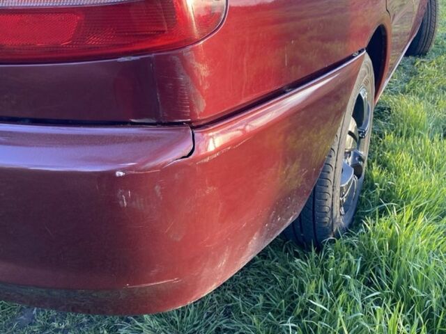 Красный Мицубиси Лансер, объемом двигателя 1.3 л и пробегом 182 тыс. км за 3000 $, фото 5 на Automoto.ua