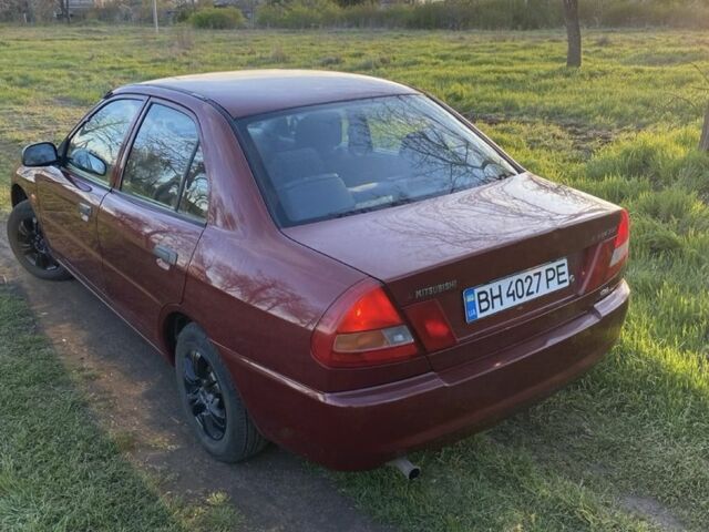 Красный Мицубиси Лансер, объемом двигателя 1.3 л и пробегом 182 тыс. км за 3000 $, фото 3 на Automoto.ua