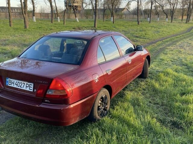 Красный Мицубиси Лансер, объемом двигателя 1.3 л и пробегом 182 тыс. км за 3000 $, фото 4 на Automoto.ua