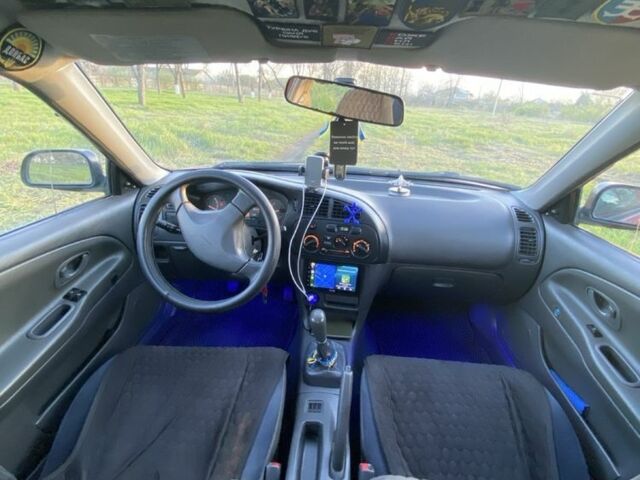 Красный Мицубиси Лансер, объемом двигателя 1.3 л и пробегом 182 тыс. км за 3000 $, фото 8 на Automoto.ua