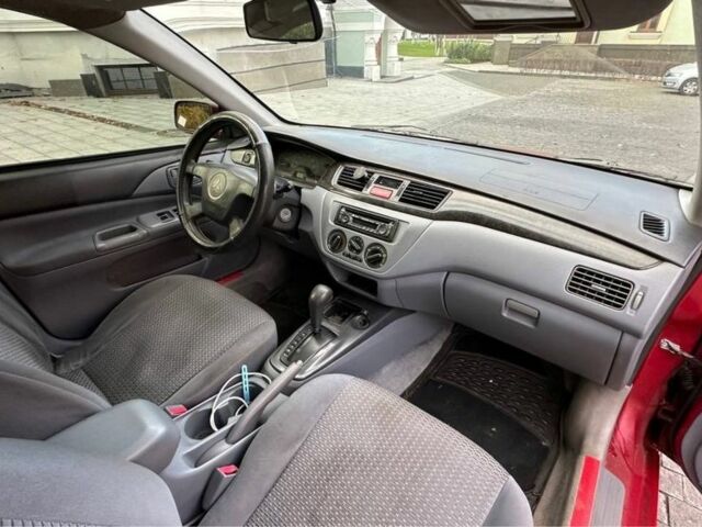 Красный Мицубиси Лансер, объемом двигателя 2 л и пробегом 350 тыс. км за 3399 $, фото 4 на Automoto.ua