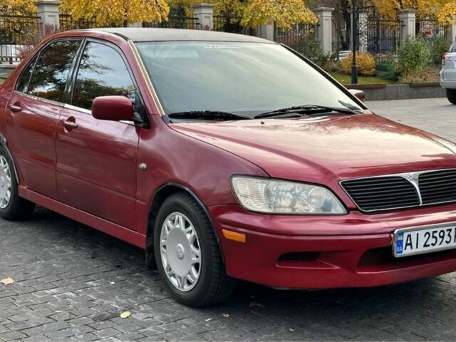 Красный Мицубиси Лансер, объемом двигателя 2 л и пробегом 350 тыс. км за 3399 $, фото 1 на Automoto.ua