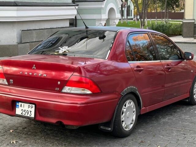 Красный Мицубиси Лансер, объемом двигателя 2 л и пробегом 350 тыс. км за 3399 $, фото 2 на Automoto.ua