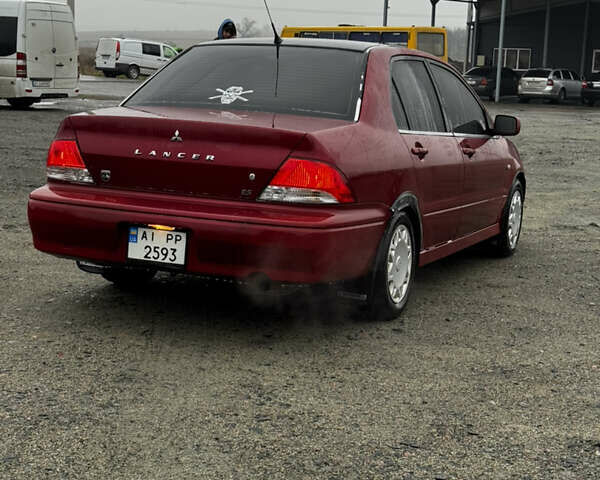 Красный Мицубиси Лансер, объемом двигателя 2 л и пробегом 202 тыс. км за 2599 $, фото 5 на Automoto.ua