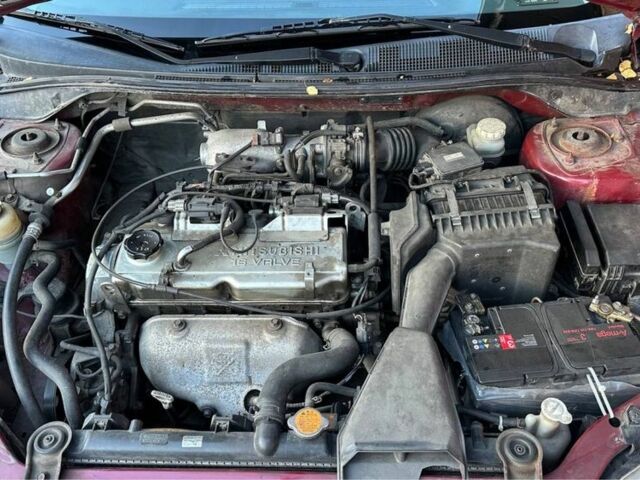 Красный Мицубиси Лансер, объемом двигателя 2 л и пробегом 350 тыс. км за 3399 $, фото 5 на Automoto.ua