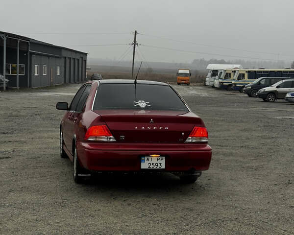 Красный Мицубиси Лансер, объемом двигателя 2 л и пробегом 202 тыс. км за 2599 $, фото 3 на Automoto.ua