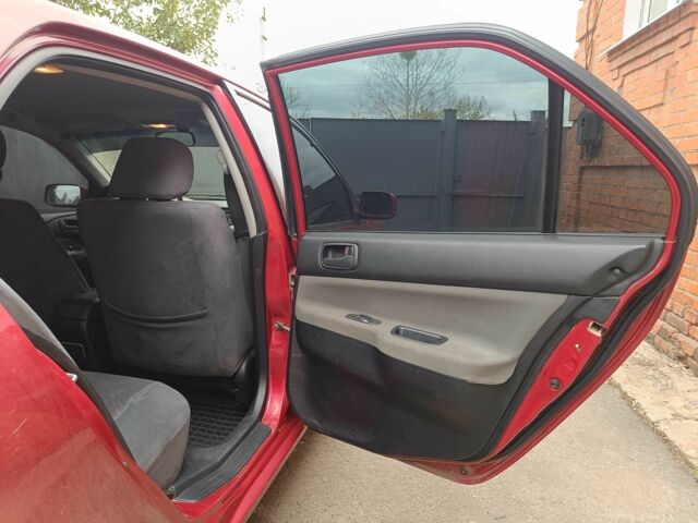 Міцубісі Lancer 2003 у Харкові на Automoto.ua Червоний Міцубісі Lancer, об'ємом двигуна 1.6 л та пробігом 302 тис. км за 3800 $, фото 7 на Automoto.ua