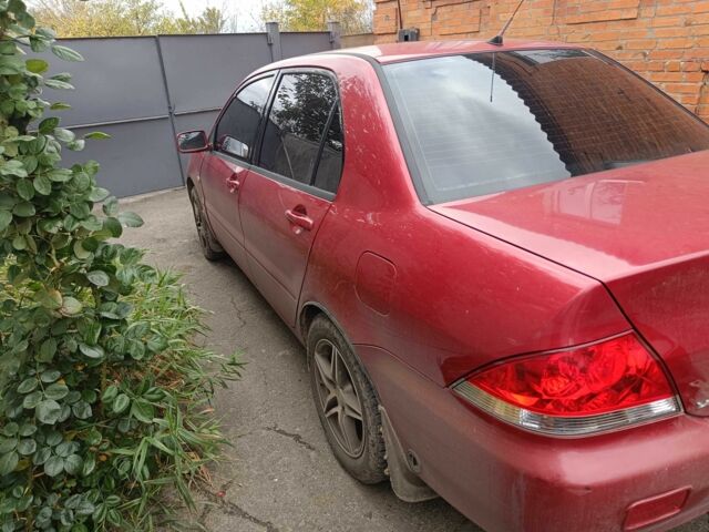 Міцубісі Lancer 2003 у Харкові на Automoto.ua Червоний Міцубісі Lancer, об'ємом двигуна 1.6 л та пробігом 302 тис. км за 3800 $, фото 12 на Automoto.ua