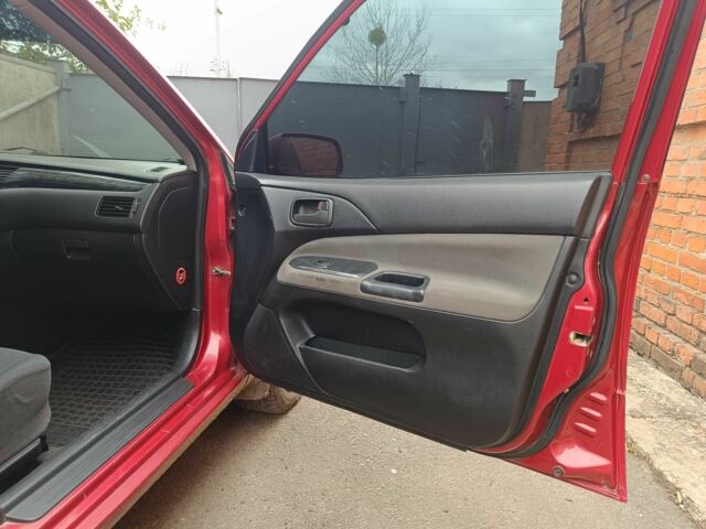 Міцубісі Lancer 2003 у Харкові на Automoto.ua Червоний Міцубісі Lancer, об'ємом двигуна 1.6 л та пробігом 302 тис. км за 3800 $, фото 6 на Automoto.ua