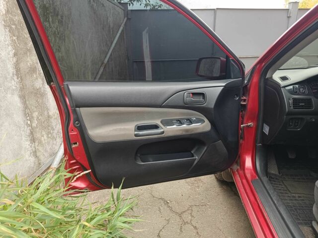 Міцубісі Lancer 2003 у Харкові на Automoto.ua Червоний Міцубісі Lancer, об'ємом двигуна 1.6 л та пробігом 302 тис. км за 3800 $, фото 3 на Automoto.ua