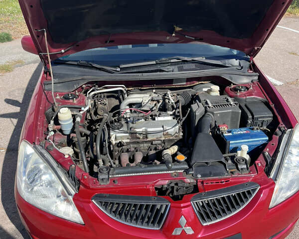 Червоний Міцубісі Lancer, об'ємом двигуна 1.58 л та пробігом 300 тис. км за 3200 $, фото 5 на Automoto.ua