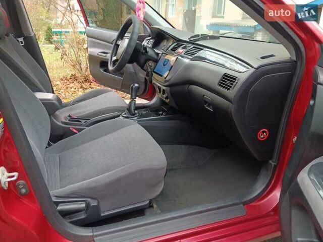 Червоний Міцубісі Lancer, об'ємом двигуна 1.3 л та пробігом 223 тис. км за 4250 $, фото 25 на Automoto.ua