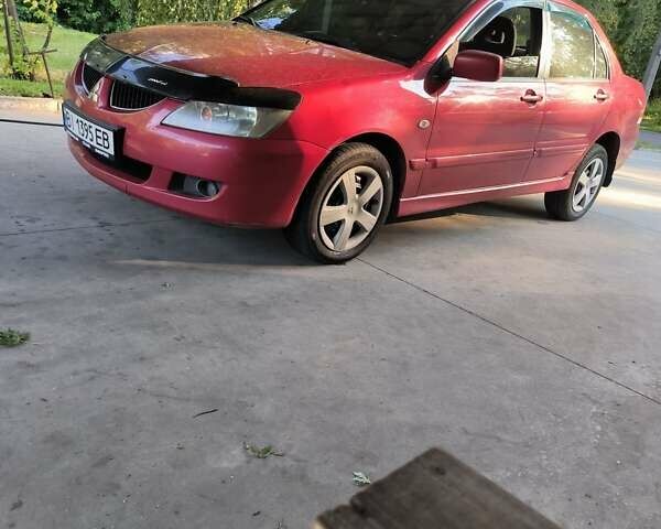 Красный Мицубиси Лансер, объемом двигателя 1.6 л и пробегом 400 тыс. км за 3100 $, фото 6 на Automoto.ua