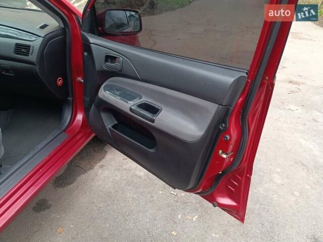 Червоний Міцубісі Lancer, об'ємом двигуна 1.3 л та пробігом 223 тис. км за 4250 $, фото 30 на Automoto.ua