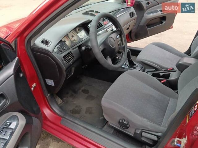 Червоний Міцубісі Lancer, об'ємом двигуна 1.3 л та пробігом 223 тис. км за 4250 $, фото 36 на Automoto.ua