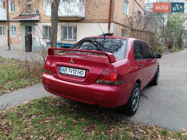 Червоний Міцубісі Lancer, об'ємом двигуна 1.3 л та пробігом 223 тис. км за 4250 $, фото 13 на Automoto.ua