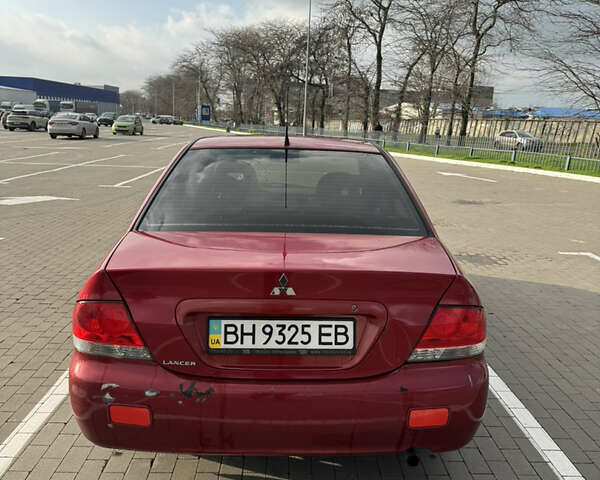 Червоний Міцубісі Lancer, об'ємом двигуна 1.58 л та пробігом 271 тис. км за 4100 $, фото 4 на Automoto.ua