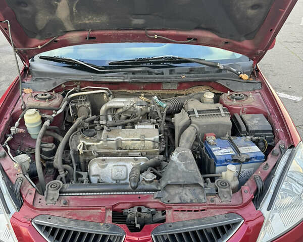 Червоний Міцубісі Lancer, об'ємом двигуна 1.58 л та пробігом 271 тис. км за 4100 $, фото 11 на Automoto.ua