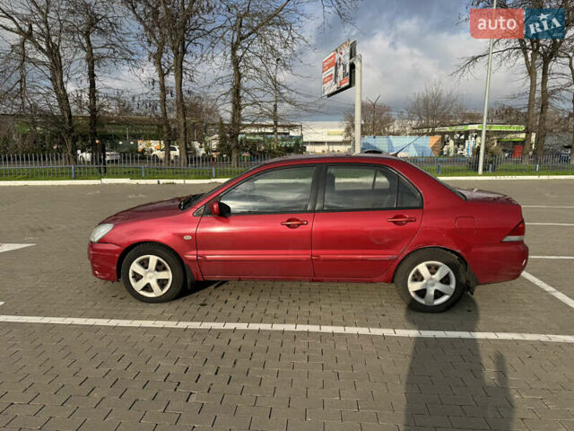 Червоний Міцубісі Lancer, об'ємом двигуна 1.58 л та пробігом 271 тис. км за 4100 $, фото 1 на Automoto.ua